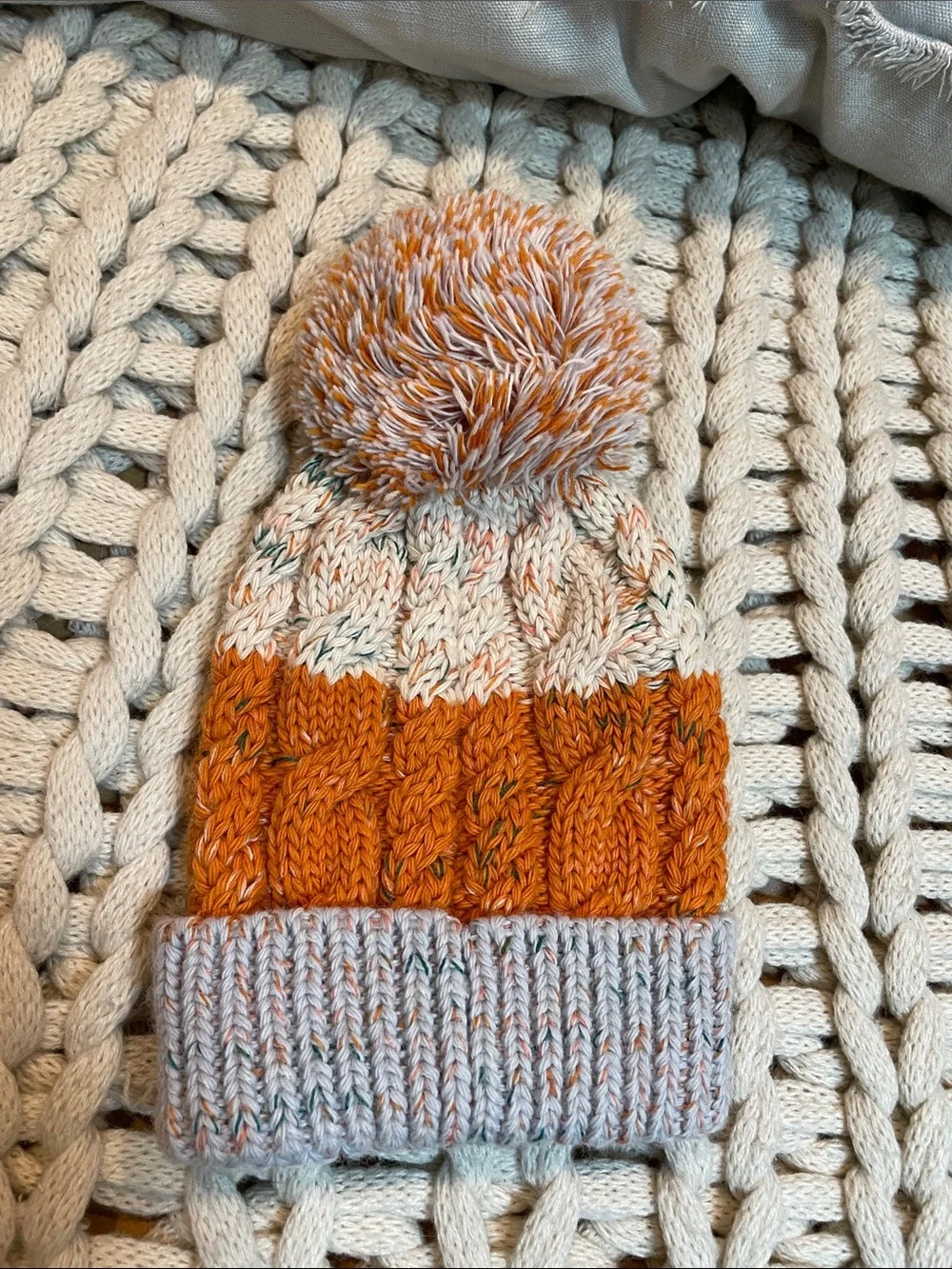 Smartwool Kids Isto Retro Cable Knit Pom Beanie in Orange and Cream and Gray
